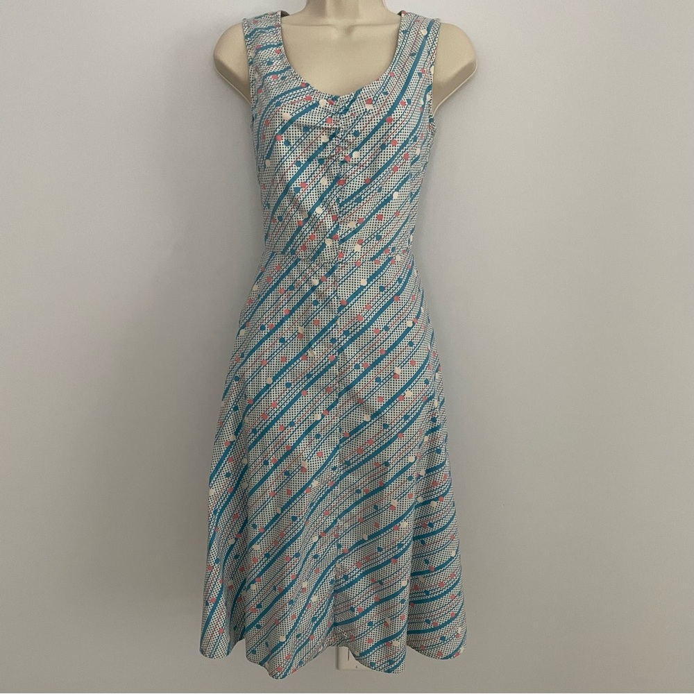 A-line sundress with bright dots and stripes.
